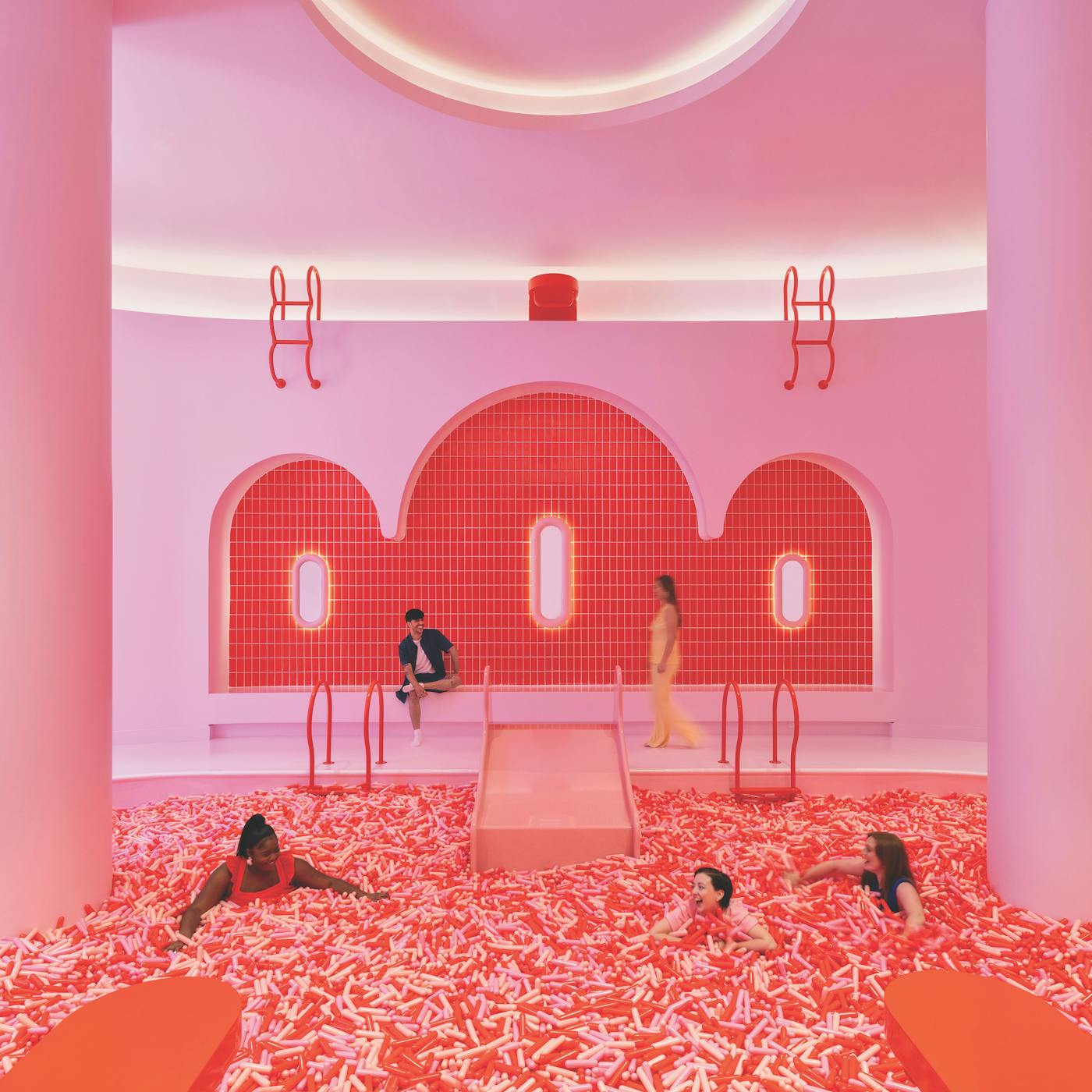 People swimming in giant sprinkle pool at Museum Of Ice Cream in Chicago, Illinois (photo courtesy of Museum Of Ice Cream))