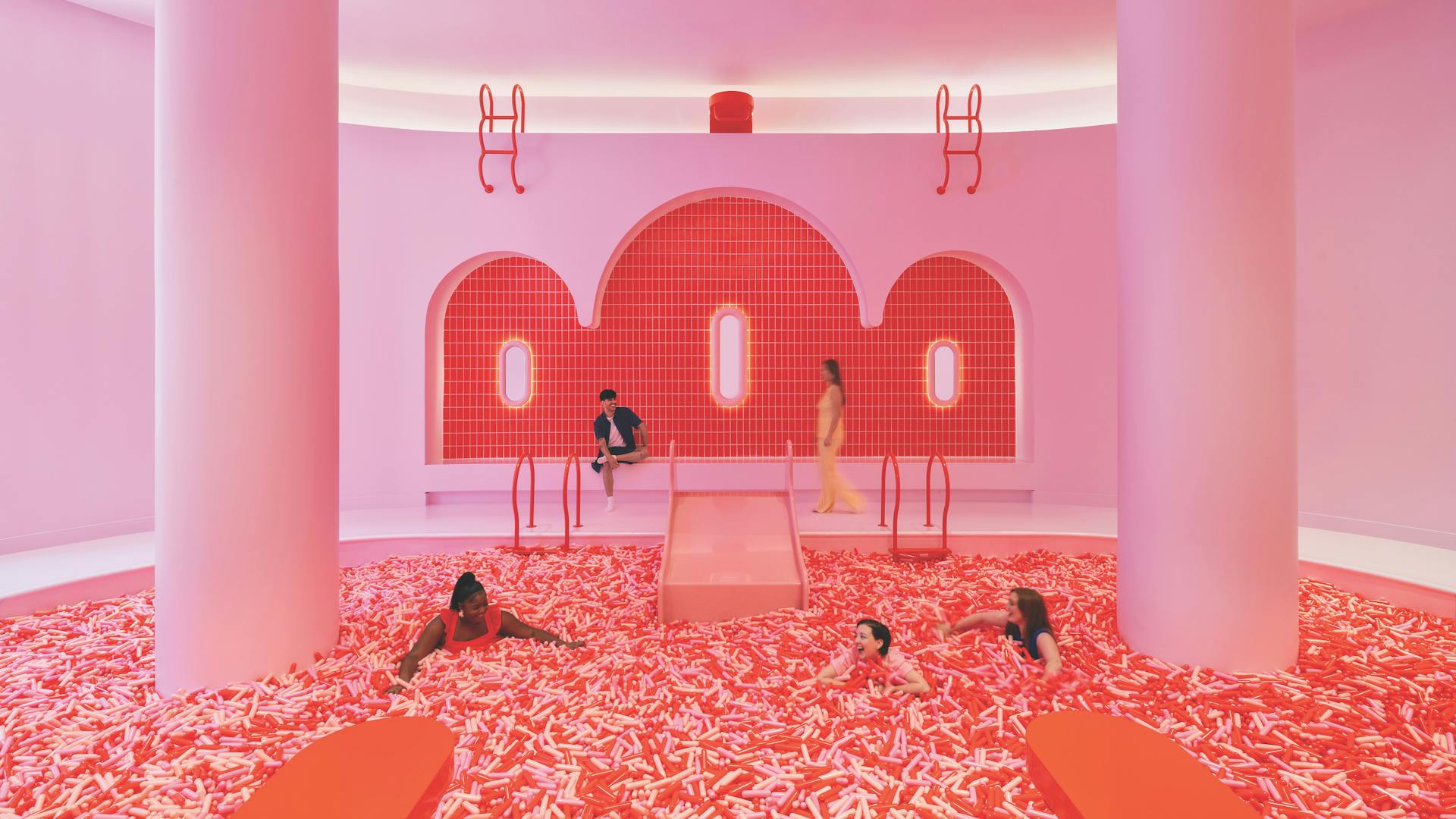 People swimming in giant sprinkle pool at Museum Of Ice Cream in Chicago, Illinois (photo courtesy of Museum Of Ice Cream)