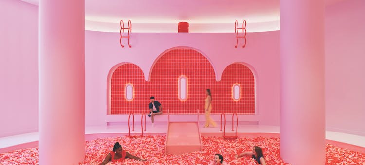 People swimming in giant sprinkle pool at Museum Of Ice Cream in Chicago, Illinois (photo courtesy of Museum Of Ice Cream)