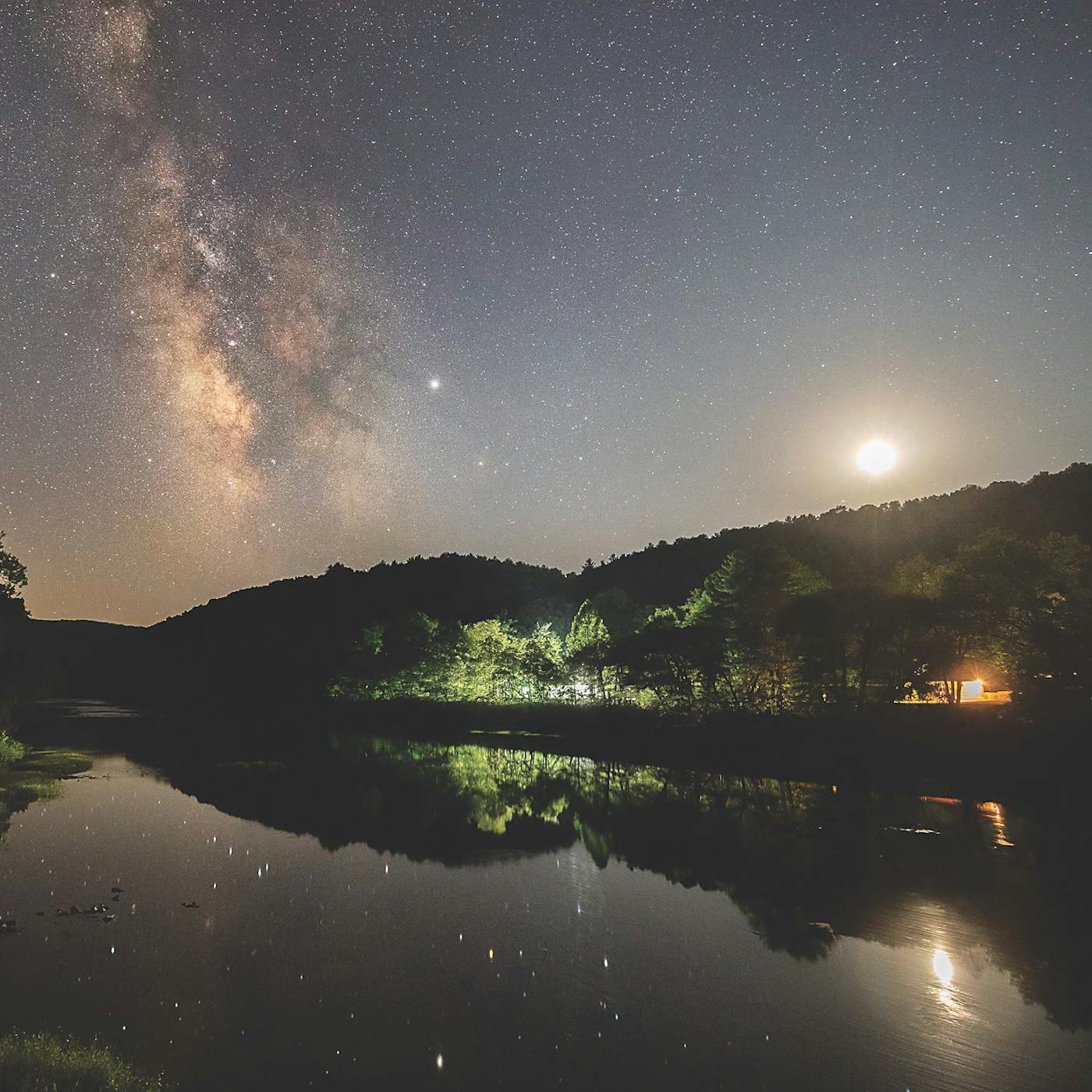 Night sky reflected in lake at Watoga State Park in Pocahontas County, West Virginia (photo by Jessie Thornton))