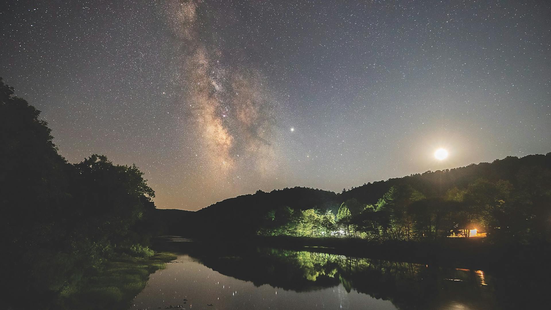 Night sky reflected in lake at Watoga State Park in Pocahontas County, West Virginia (photo by Jessie Thornton)