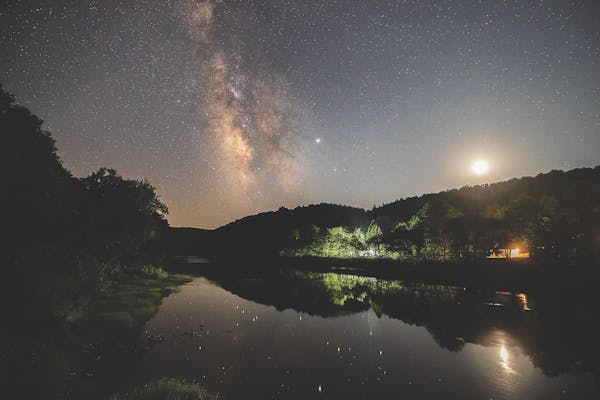Night sky reflected in lake at Watoga State Park in Pocahontas County, West Virginia (photo by Jessie Thornton)
