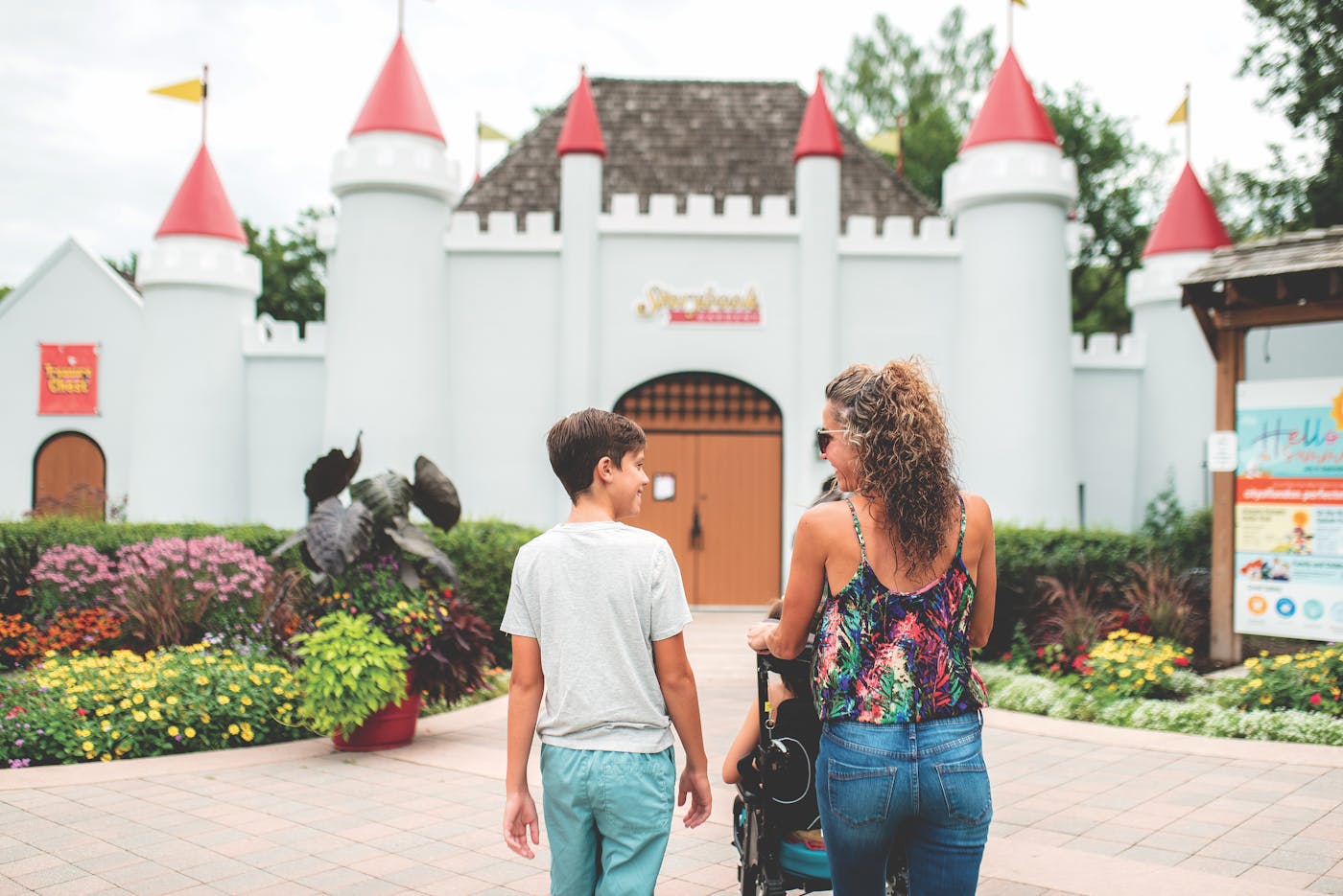 Mother and kids entering castle at Storybook Gardens in London, Ontario (photo by Dudek Photography))