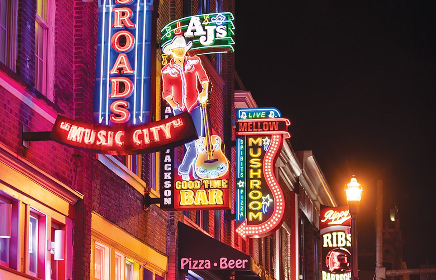 Neon signs lining street along Broadway Nashville, Tennessee (photo by iStock)