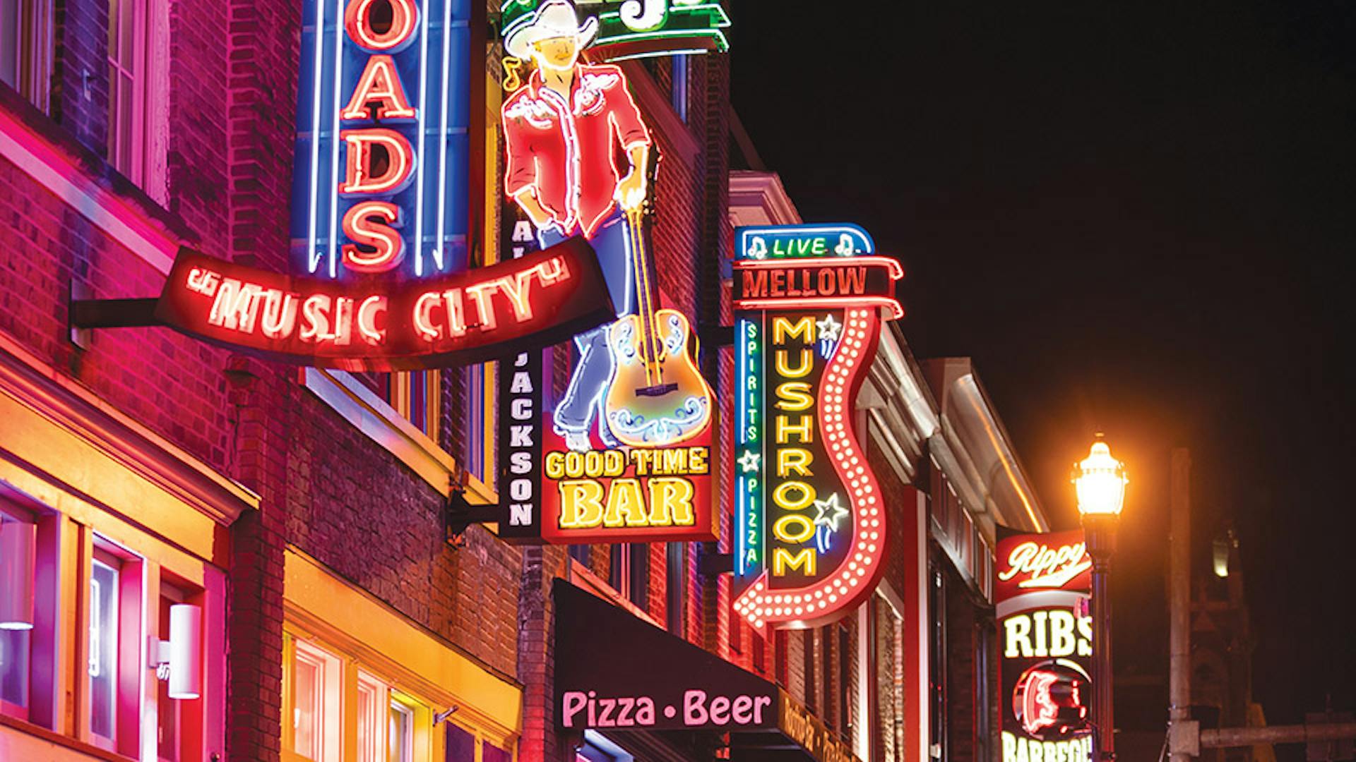 Neon signs lining street along Broadway Nashville, Tennessee (photo by iStock)