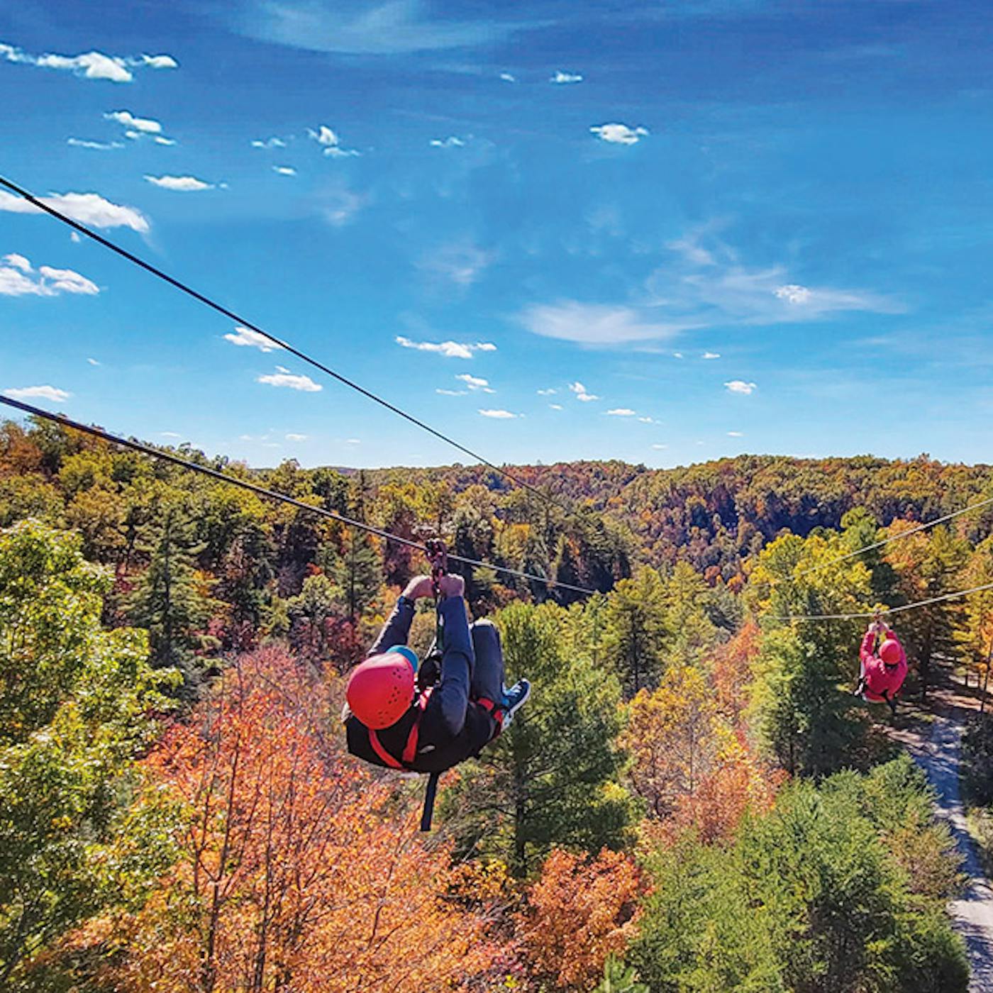 People zip lining at Red River Gorge Ziplines in Campton, Kentucky (photo courtesy of Red River Gorge Ziplines))