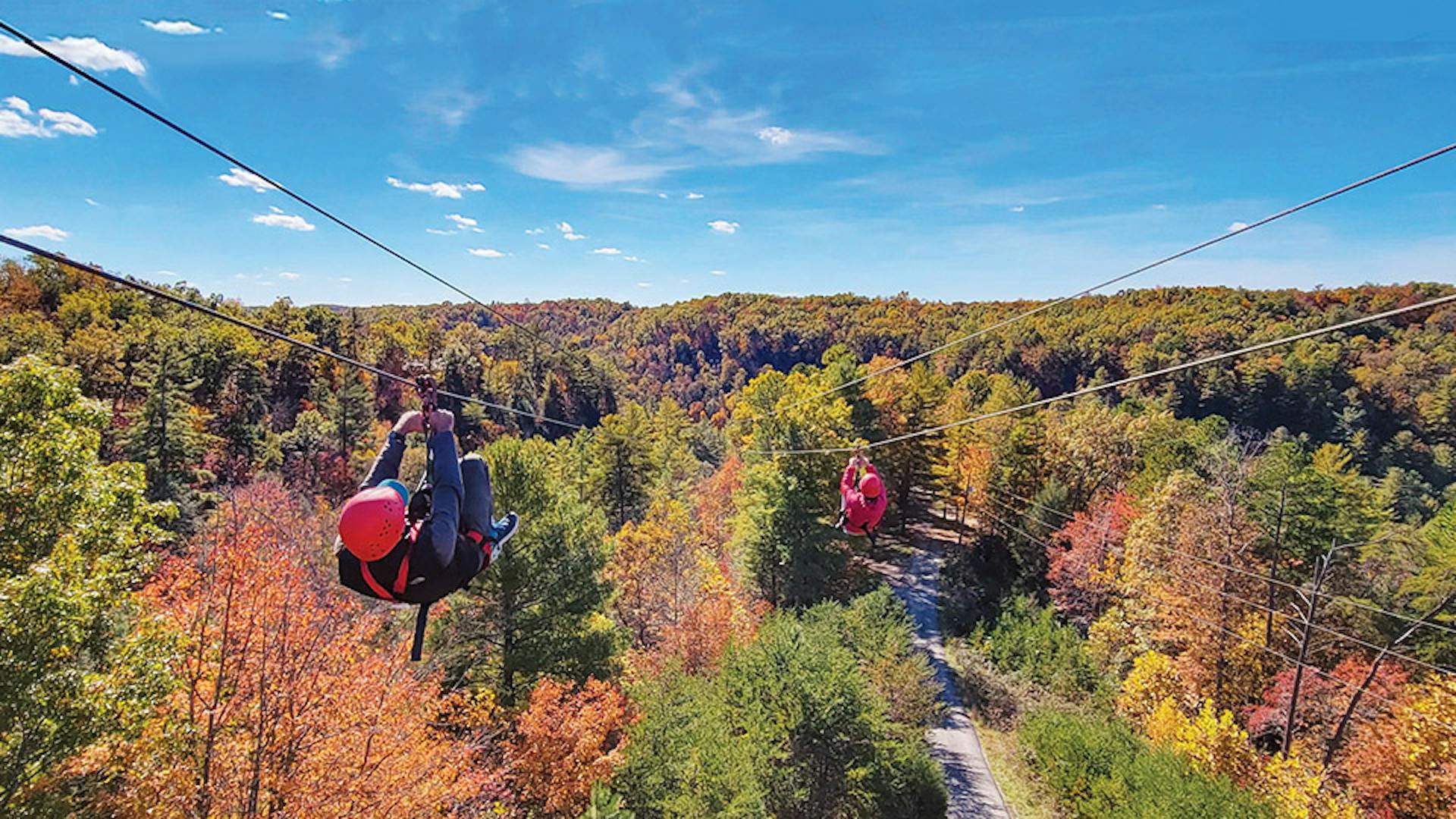 People zip lining at Red River Gorge Ziplines in Campton, Kentucky (photo courtesy of Red River Gorge Ziplines)