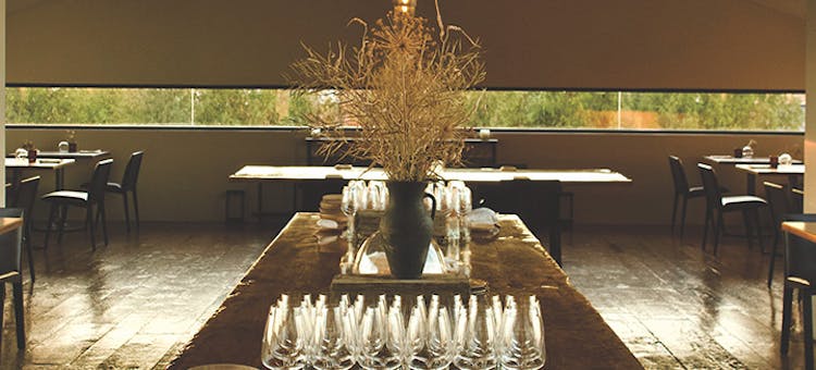 Rustic tables and wine glasses at Restaurant Pearl Morissette in Jordan Station, Ontario (photo courtesy of Restaurant Pearl Morissette)