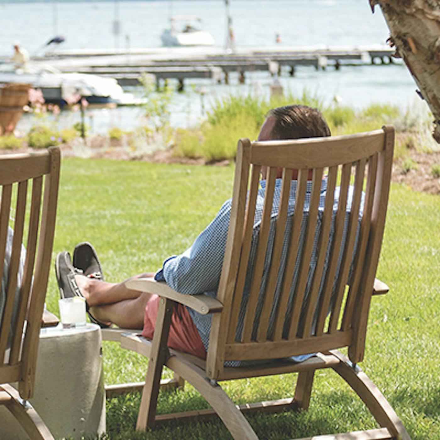 Couple sitting in lawn chairs lakeside at The Lake House on Canandaigua in Canandaigua, New York (photo courtesy of The Lake House on Canandaigua))