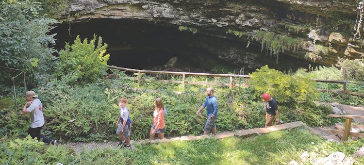 People walking out of Hidden River Cave entrance in Horse Cave, Kentucky (photo courtesy of Hidden River Cave)