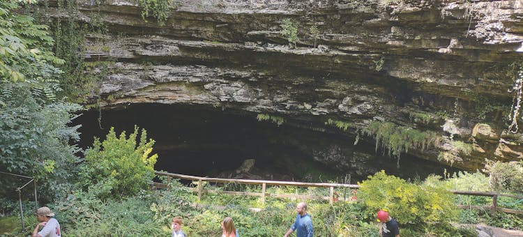 People walking out of Hidden River Cave entrance in Horse Cave, Kentucky (photo courtesy of Hidden River Cave)