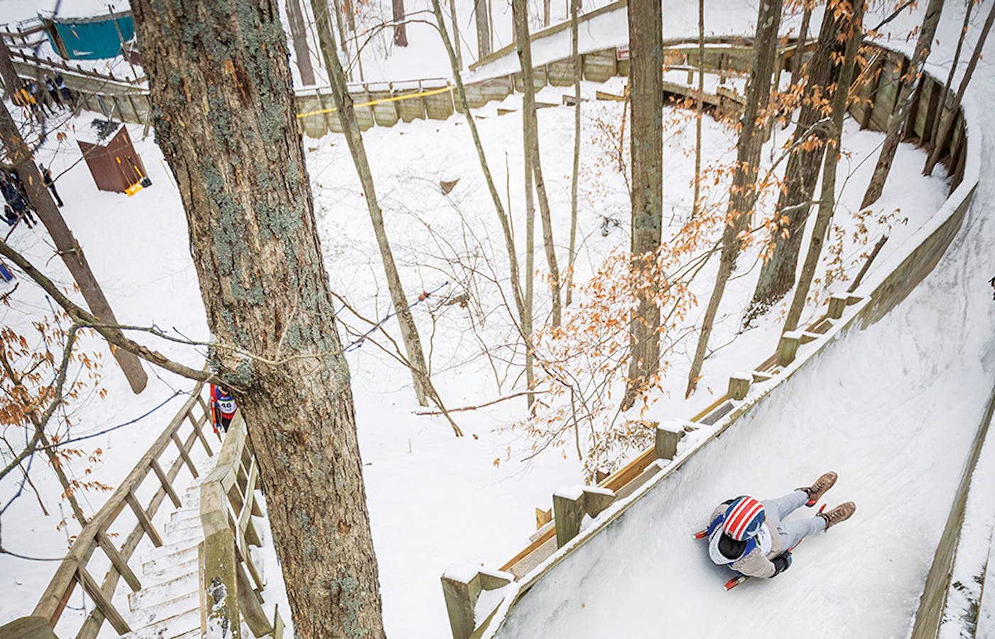 Person riding down luge at Muskegon Luge Adventure Sports Park in Muskegon, Michigan (photo by Adam Alexander Photography)