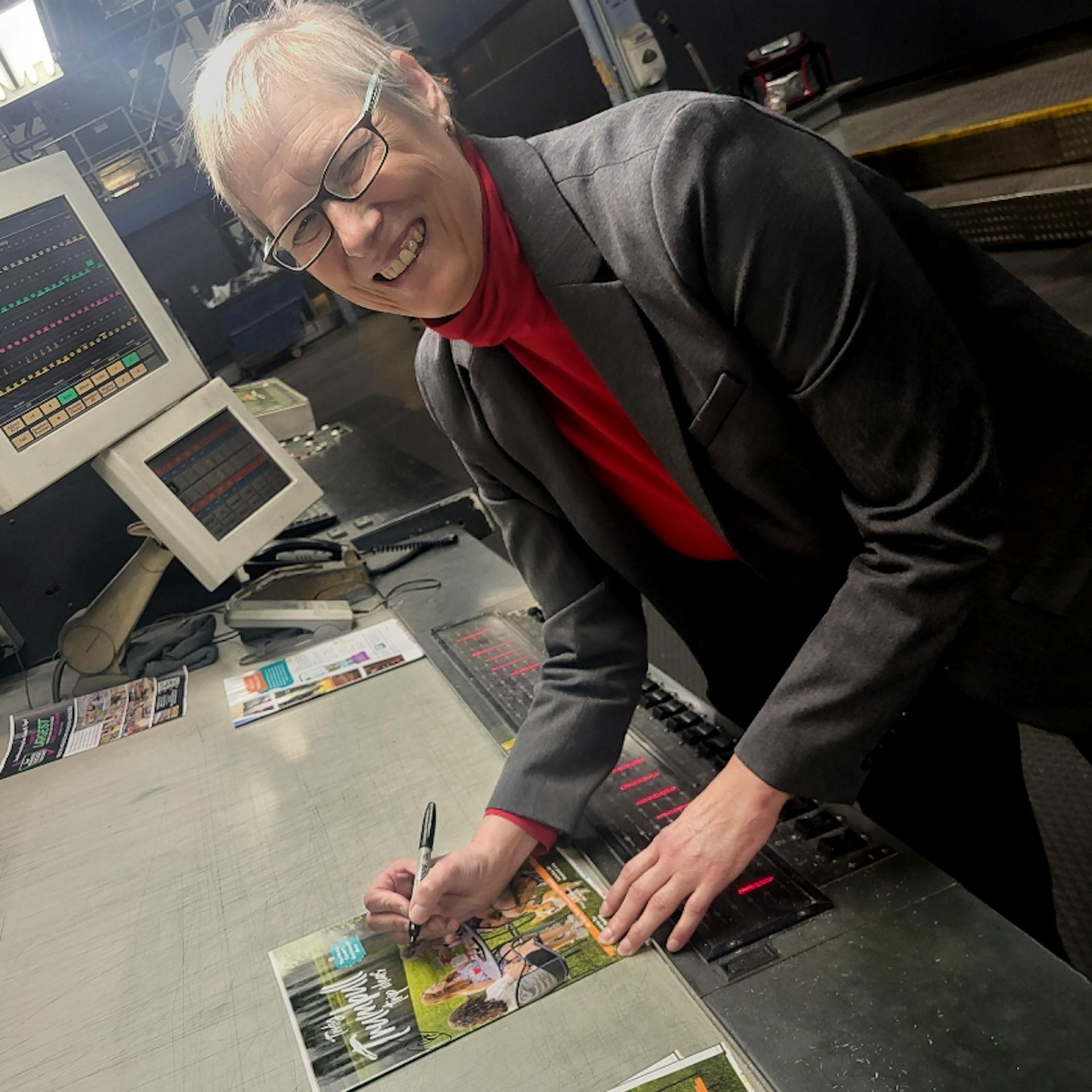 The team checks out color at the print check.