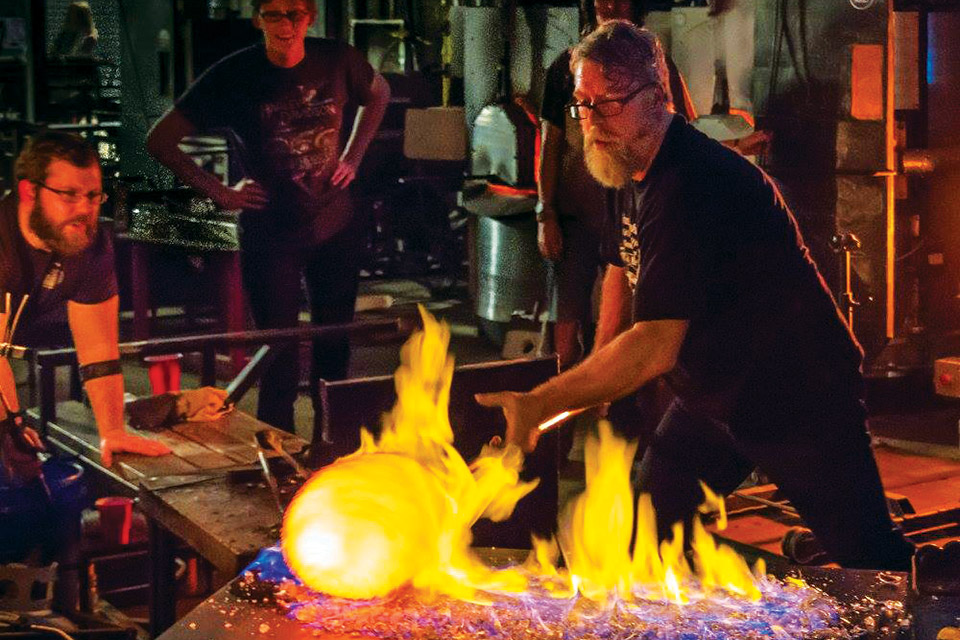Glass blower demonstrate their art at Glass Axis in Columbus